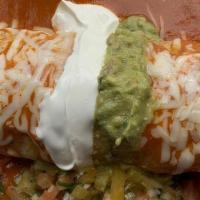 Burrito De Camaron · Wet Shrimp burrito rice, beans, cheese inside
sour cream, guacamole, & Mexican salsa on top.