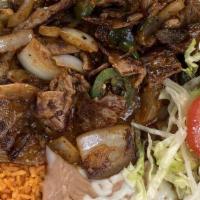 Steak Ranchero · Served with rice beans lettuce tomatoes and cheese.