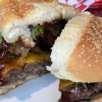 Hickory Burger (Regular) · BBQ sauce, bacon, onion rings, tomato, lettuce, cheddar.