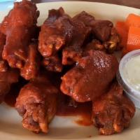 16 Bone-In Wings · 16 bone-in wings tossed in your choice of 2 flavors. Served with seasoned fries and a side o...
