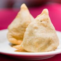 Vegetable Samosa (2 Pieces) · Golden brown fried pastries with stuffing of potato, green peas,  and our chef’s blend of ex...