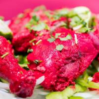 Tandoori Chicken · Half chicken marinated in yogurt and fresh ground spices, cooked over charcoal in our tradit...