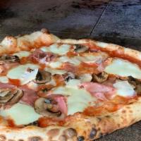 Pizza Prosciutto · San Marzano Tomatoes, Fresh Mozzarella, Prosciutto, Mushrooms, Shaved Parmesan and Olive Oil