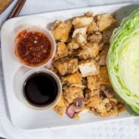 Chicken Lettuce Wraps · Stir-fried with diced water chestnut, shiitake mushrooms, and onions; served with iceberg le...