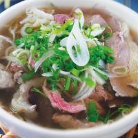 Combination Pho · Rare steak, brisket, meatball, tendon,  tripe and onions topped on rice noodles; served with...
