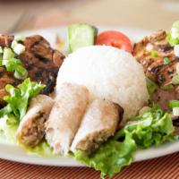Super Platter · Vietnamese pork egg rolls grilled beef, chicken, and pork chop, topped with onions; served w...