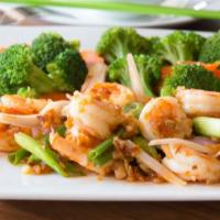 Royal Shrimp · Sauteed in spicy butter garlic sauce with onions, steamed veggie and white rice.