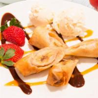 Fried Banana · Crispy banana pieces wrapped in wonton wrappers served with vanilla ice cream drizzled with ...