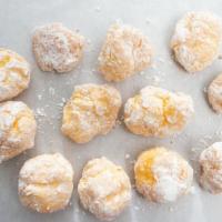 Cream Puffs · Filled with bavarian cream and coated with powder sugar.