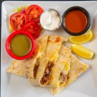 Quesadilla · Large flour tortilla with cheese and your choice of preparation.