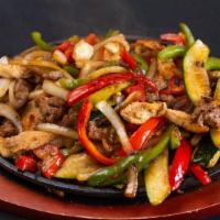 Fajitas · With green and red peppers, onions, zucchini served with rice and beans your choice of prepa...