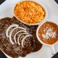 Enchiladas · (Don mole navarro, green or red sauce) chicken or asada, cheese, cream and onions served wit...