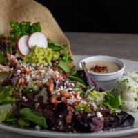 Tostada Salad · Romaine lettuce, spring mix, refried beans, fresh guacamole, pico de gallo & queso fresco in...