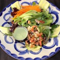 El Dorado House Salad · Mixed greens, cucumber, carrots, fresh Hass avocados & pico de gallo with house-made cilantr...