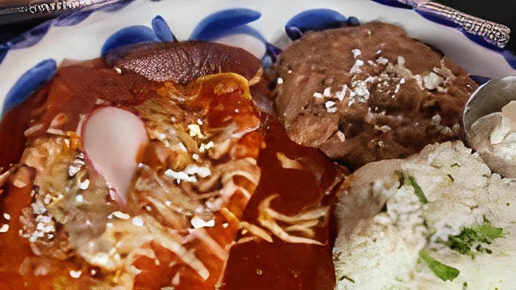 Steak Enchiladas · Oaxacan & Monterey Jack cheese & grilled steak wrapped in fresh corn tortillas, topped with red enchilada sauce, sour cream & queso fresco. Gluten-free. Served with cilantro rice & refried beans. Gluten friendly.