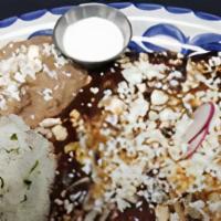 Cheese Enchiladas · Oaxacan & Monterey Jack cheese wrapped in fresh corn tortillas, topped with red enchilada sa...