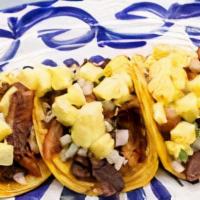 Al Pastor Taco · Gluten-free. Three tacos per platter. Roasted pork with pineapple, cilantro, onion & lime.Gl...
