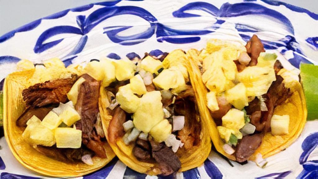 Al Pastor Taco · Gluten-free. Three tacos per platter. Roasted pork with pineapple, cilantro, onion & lime.Gluten friendly.