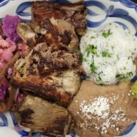 Pork Carnitas · Slow-cooked pork, pickled vegetables, pico de gallo, fresh guacamole, refried beans, cilantr...