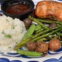 Rudolph'S Cedar Chipotle Salmon · Grilled wild salmon on a cedar plank with honey chipotle glaze served with cilantro rice,. p...