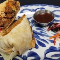 Carnitas Rajas Burrito · Slow cooked marinated pork with cilantro rice, rajas, refried beans, fresh guacamole, Oaxaca...