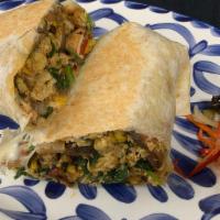 Breakfast Veggie Burrito · Organic egg, marinated portobello mushrooms, spinach, roasted corn, crispy potatoes with chi...
