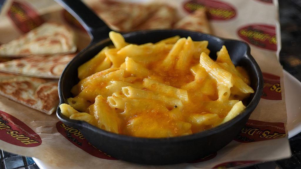 Mac & Cheese 410 · Created at our first HopsnDrops in Bonney Lake. You never forget your first. Our own home grown cheesy mac and cheese. Served with garlic buttered pita bread.