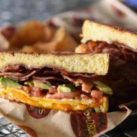 Rise & Shine Grilled Cheese · Cheddar & pepper Jack cheese melted with bacon, ham, fried egg over hard, fresh avocado and ...