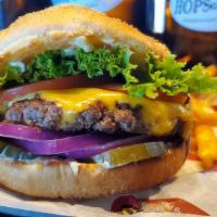 Deluxe Burger · American cheese, lettuce, tomato, pickle, red onion and HopsnDrops spread.
