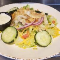 Side Salad · A blend of mixed greens, shredded cheddar cheese, cucumbers, red onions, tomatoes and crispy...