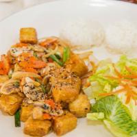 Tofu Teriyaki · Fried tofu with teriyaki sauce. Served with rice and salad w/ house dressing.