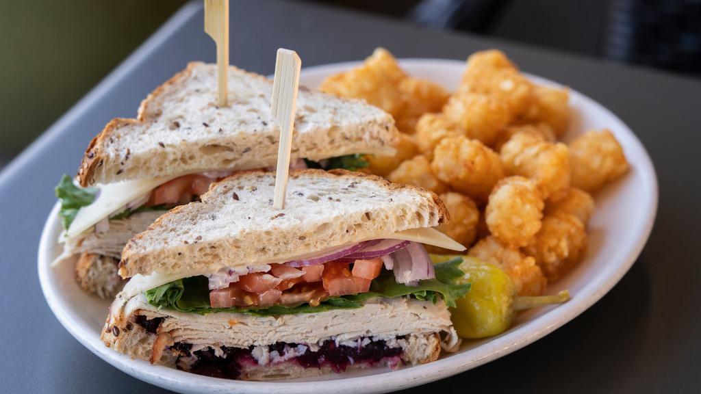 Whole Fireside Roasted Turkey Sandwich · Herb roasted turkey, fireside cranberry relish and swiss cheese served on the whole wheat bread with lettuce, tomato, red onion and secret sauce.