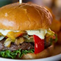 Communication Breakdown Burger · Grilled mushrooms, onions, & bell peppers topped with Cheddar cheese, lettuce, tomato, pickl...