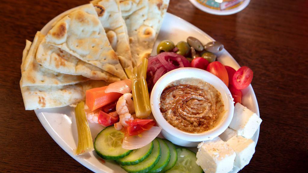 Hummus  Plate · Vegetarian. Marinated olives, vegyes, feta, and pita bread.