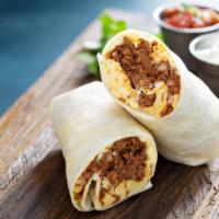 Sausage Breakfast Burrito · Burrito wrapped in with sizzling scrambled eggs, sausage pieces and cheese and served.
