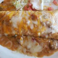 Ground Beef Smothered Burrito · Smothered in green chili. Served with cheese, lettuce, tomato