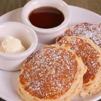Brown Sugar Oatmeal Gluten Free Pancakes · served with whipped butter and warm maple syrup