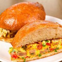 Sausage & Cheddar · scrambled eggs, sausage, scallions, roasted red peppers, cheddar & cilantro on grilled brioche