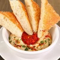 Classic Hummus · mama lil’s peppers, paprika & olive oil served with grilled herb focaccia