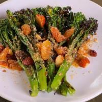 Sautéed Broccolini · golden raisins, smokehouse almonds, bread crumbs & chili vinaigrette
