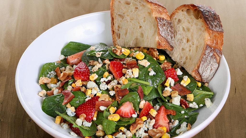Strawberry Spinach · spinach, bacon, gorgonzola, strawberries, organic dried sweet corn, basil, toasted walnuts & all-natural chipotle poppyseed dressing served with artisan bread