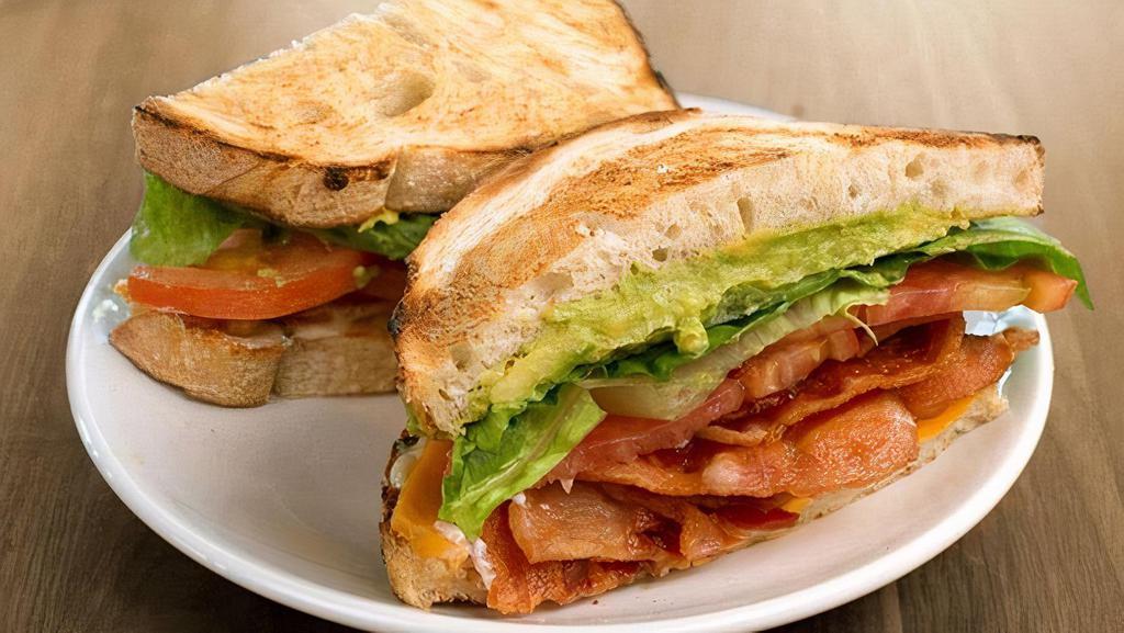 Blt+ · bacon, lettuce, tomatoes, cheddar, avocado, herb mayo on toasted sourdough & served with a side