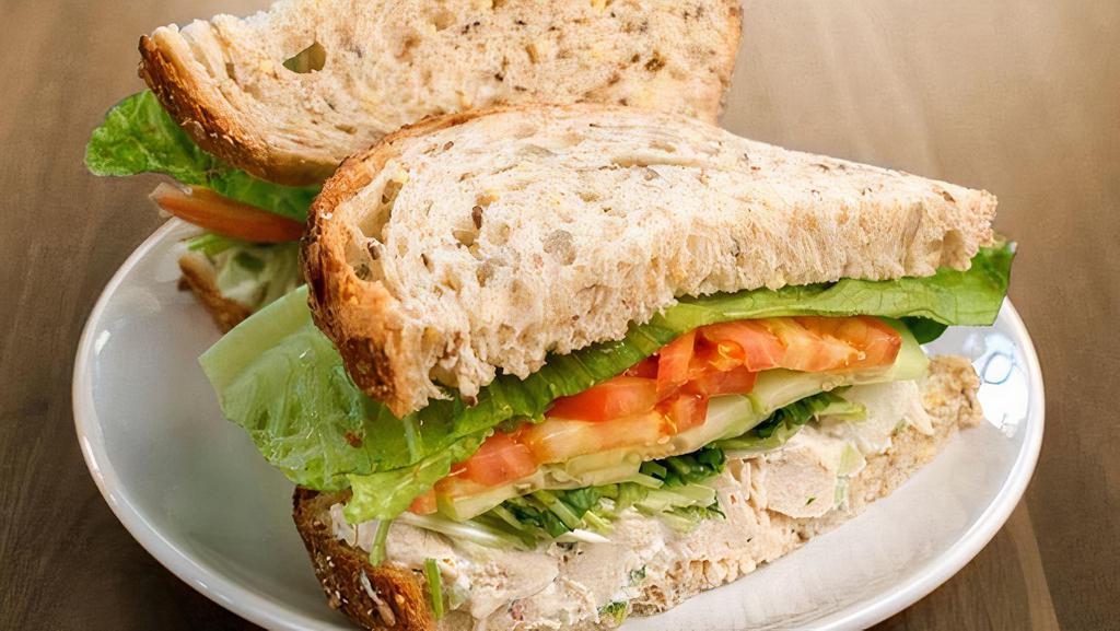 Chicken Salad · all-natural chicken breast, red peppers, jicama, celery, scallions, lemon, garlic & mayo with tomatoes, cucumbers, lettuce, pea shoots on nine grain & served with a side