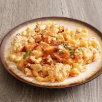 Buff Mac · The one you've been dreaming about! Our famous mac-n-cheese topped with crispy buffalo chick...