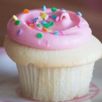 Dance Party · Pink vanilla buttercream swirled onto vanilla buttercake with a sprinkling of colorful confe...