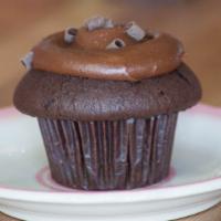 Triple Threat · A chocolate cake frosted with chocolate buttercream and then we add dark chocolate curls. Fo...