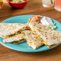 Carnitas Quesadilla · Braised pork meat served in a quesadilla with fresh cheese, refried beans, onions, and cilan...