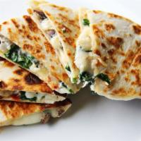 Cabeza Quesadilla · Cabeza meat quesadilla with delicious cheese, refried beans, onions, and cilantro.