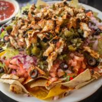 Pollo Nachos · Chicken nachos with delicious nacho cheese, sour cream, fresh guacamole, pico de gallo, and ...