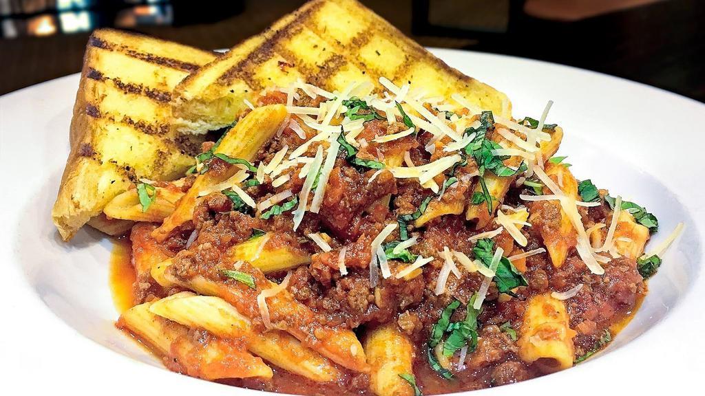 Colorado Bison Bolognese · Penne pasta topped with our house-made bison tomato sauce. Garnished with Parmesan.